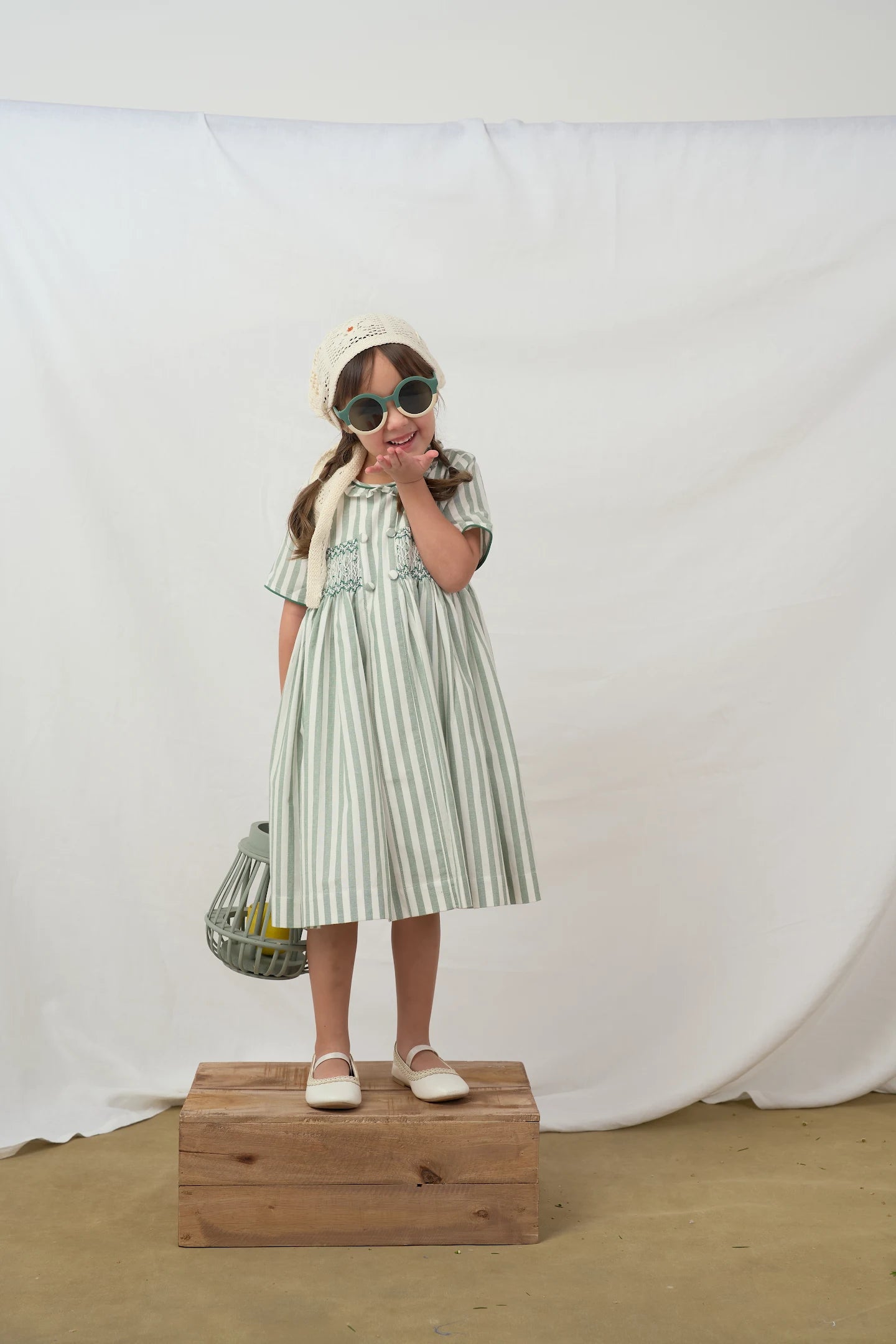 ‏Green striped smocked dress