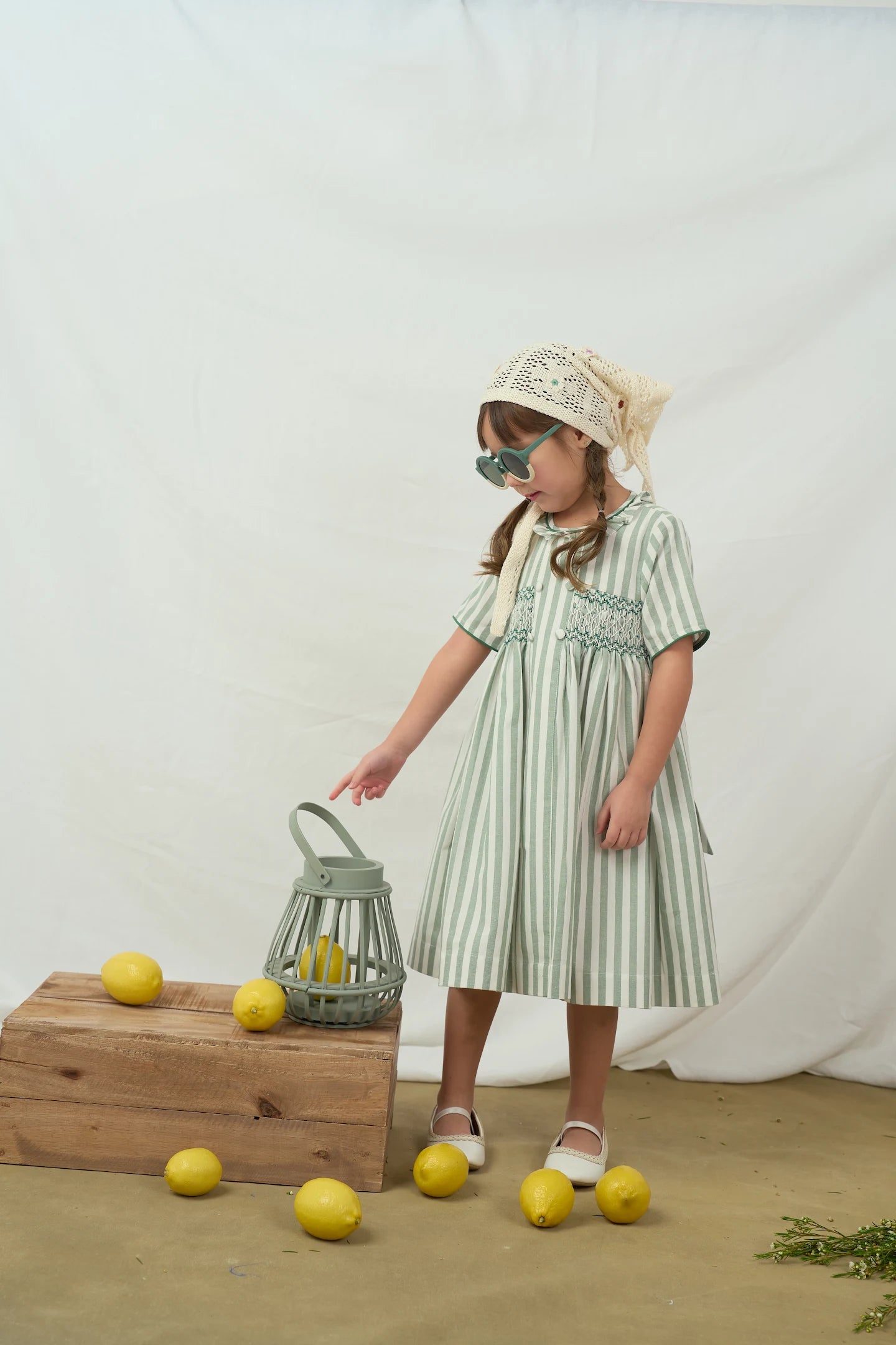 ‏Green striped smocked dress